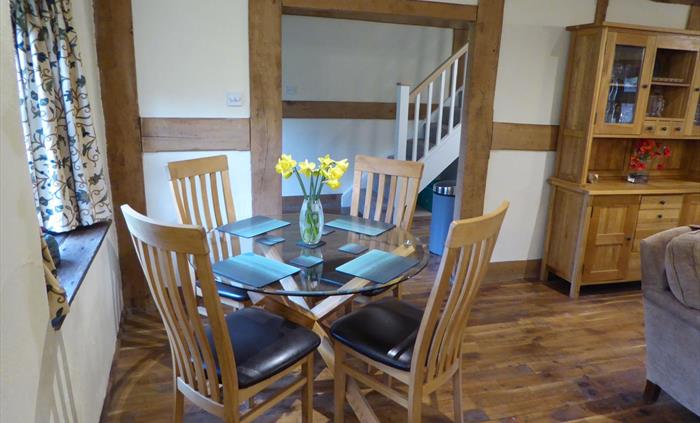 The Farmhouse at Hilltops Brecon Holiday Cottages has a ample sofas, a log-burner and fully fitted kitchen